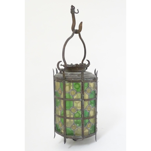 444A - A late 19thC continental stained and leaded glass (with bullseyes) cylindrical pendant lamp, with a ... 