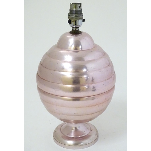 448 - A 1960s lamp of anodised aluminium with a pink/bright copper colour finish, 12 1/2'' high.