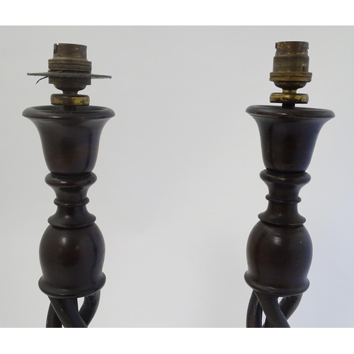 449 - A pair of mid 20thC Walnut triple open twist lampstands with circular bases ,22 1/2'' high