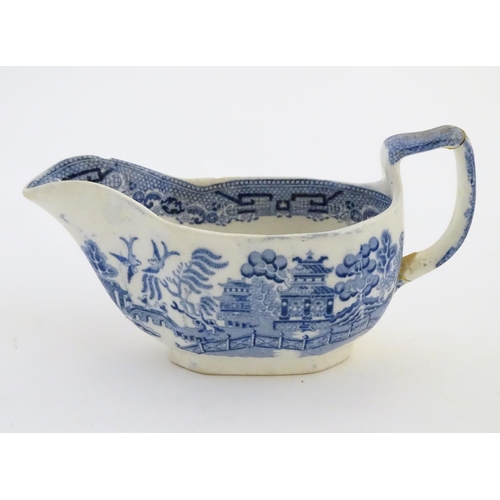 45 - A quantity of blue and white items, to include a twin handled bowl decorated with Classical urns and... 