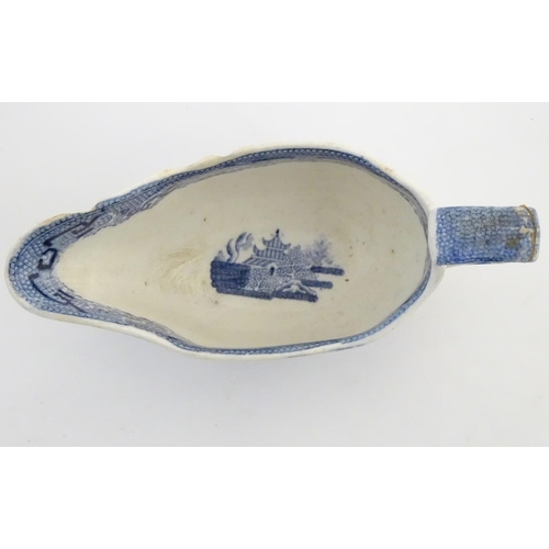 45 - A quantity of blue and white items, to include a twin handled bowl decorated with Classical urns and... 