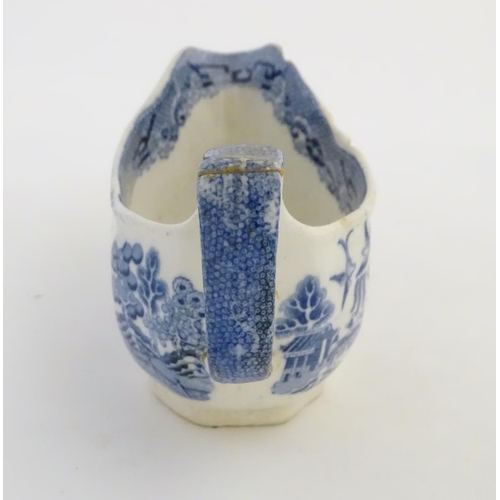 45 - A quantity of blue and white items, to include a twin handled bowl decorated with Classical urns and... 