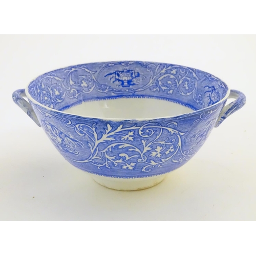 45 - A quantity of blue and white items, to include a twin handled bowl decorated with Classical urns and... 