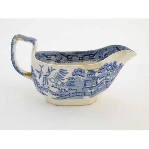 45 - A quantity of blue and white items, to include a twin handled bowl decorated with Classical urns and... 