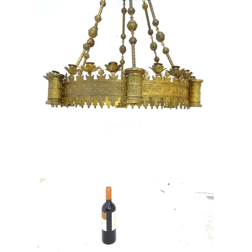 453 - Chandelier: a large Neo-Gothic circular, hanging, 2 stage brass pendant chandelier having 6 ornate s... 