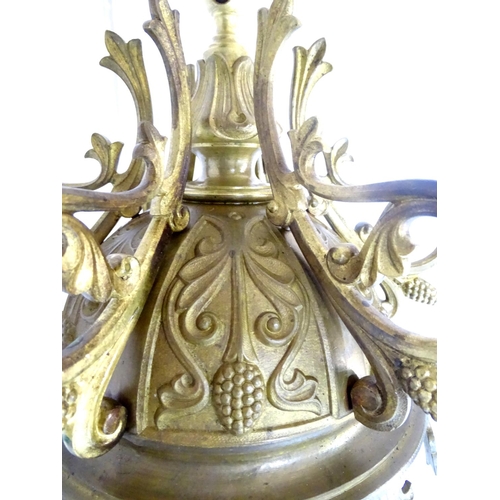 453 - Chandelier: a large Neo-Gothic circular, hanging, 2 stage brass pendant chandelier having 6 ornate s... 