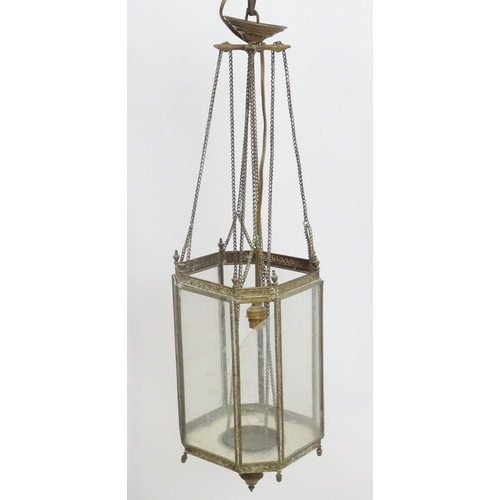 458A - Hall lantern: a brass Rise and Fall glazed lamp now converted to electricity, with raised Greek key ... 