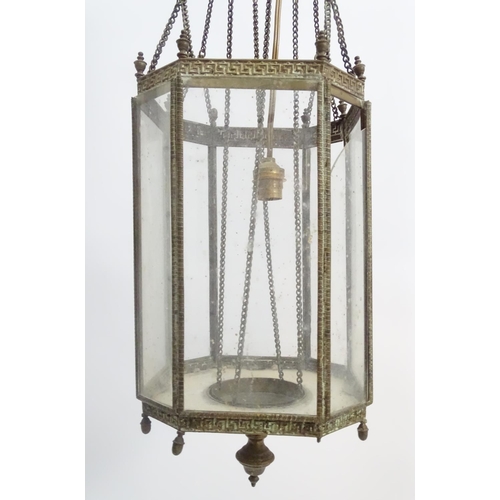 458A - Hall lantern: a brass Rise and Fall glazed lamp now converted to electricity, with raised Greek key ... 