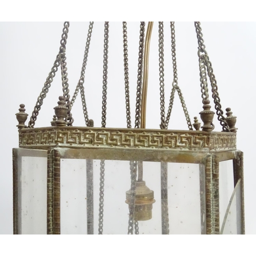 458A - Hall lantern: a brass Rise and Fall glazed lamp now converted to electricity, with raised Greek key ... 