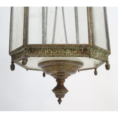 458A - Hall lantern: a brass Rise and Fall glazed lamp now converted to electricity, with raised Greek key ... 