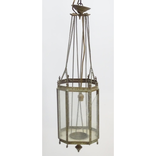 458A - Hall lantern: a brass Rise and Fall glazed lamp now converted to electricity, with raised Greek key ... 