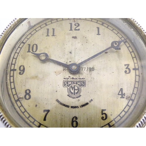 465 - A 1920s bezel wind car / automobile clock: a chromium cased dashboard clock 'Smith's, Cricklewood Wo... 