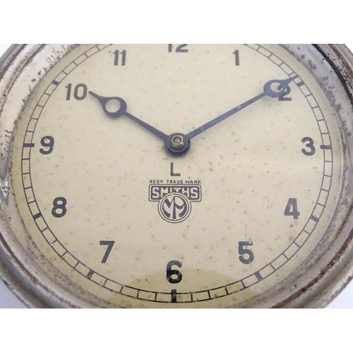 466 - 1930s car / automobile clock: a chromium and painted cased dashboard clock marked 'Smith's. L', havi... 