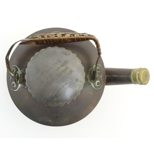 480 - Picnic Kettle: A small copper kettle with brass fitments and wicker wrapped handle. Marked '... Drew... 