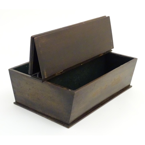 487 - An 18thC dark patinated and hinge lidded mahogany cutlery box with central handle flanked by two com... 