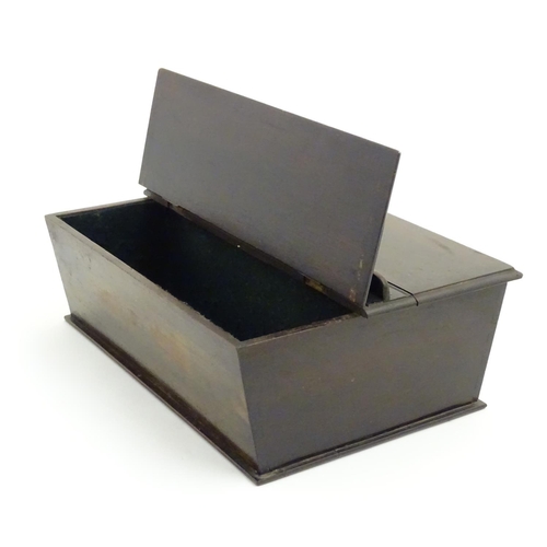 487 - An 18thC dark patinated and hinge lidded mahogany cutlery box with central handle flanked by two com... 