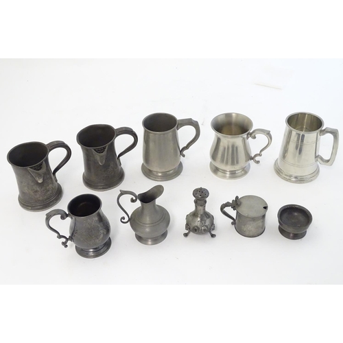 494 - Pewter : an assortment of pewter items to include tankards, tankard jugs with pouring spouts, cruet ... 