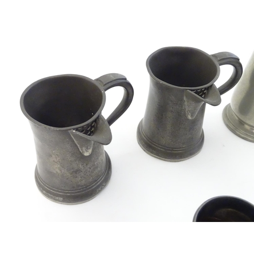 494 - Pewter : an assortment of pewter items to include tankards, tankard jugs with pouring spouts, cruet ... 