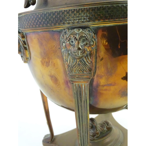 495 - Regency Samovar: a copper and brass Egyptian Revival samovar, adorned with sphinx, lion mask and foo... 