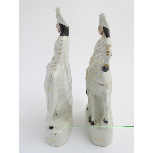 51 - A pair of Victorian Staffordshire pottery flatback figures modelled as Bonnie Prince Charlie on hors... 