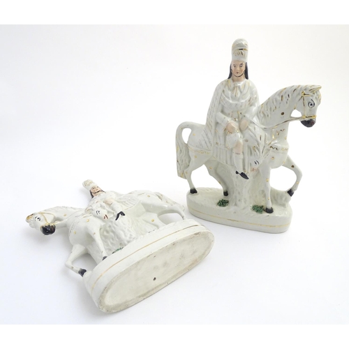 51 - A pair of Victorian Staffordshire pottery flatback figures modelled as Bonnie Prince Charlie on hors... 