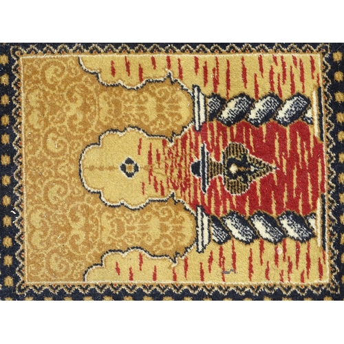 519 - Rug / Carpet: a large handmade woollen carpet, having mustard, black, yellow, red, cream etc. colour... 