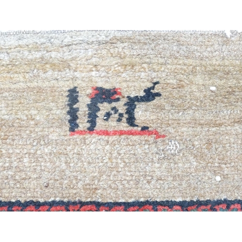 520 - Carpet / Rug : a hand woven Signed Runner with a red central ground, blue, navy blue, pink, black an... 