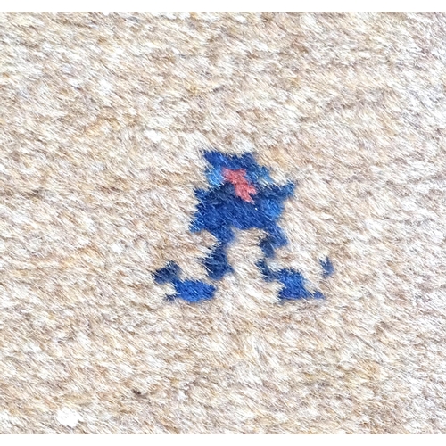 520 - Carpet / Rug : a hand woven Signed Runner with a red central ground, blue, navy blue, pink, black an... 