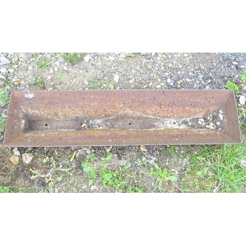 528 - Garden and Architectural Salvage: a old cast iron pig trough, marked 'Wheatley, Wickham'. 47'' long ... 