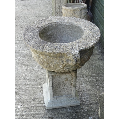 531 - A reconstituted stone urn with associated squared plinth , 25'' high