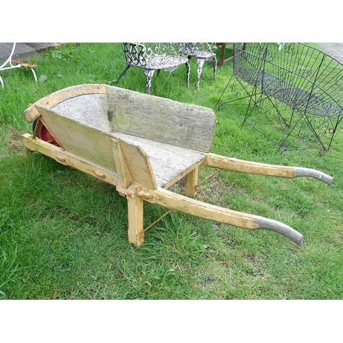 535 - Garden & Architectural , Salvage: An early to mid 20thC flower sellers wooden wheelbarrow with singl... 