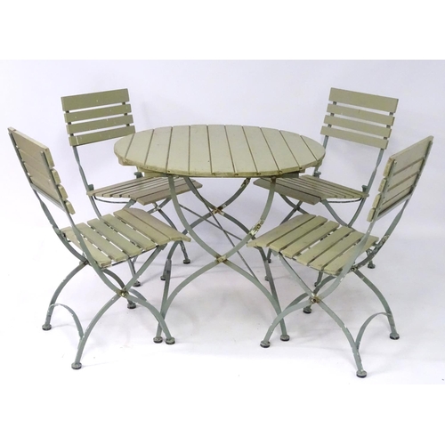 538 - Garden and Architectural Salvage: a French folding Bistro garden/patio set comprising of a circular ... 