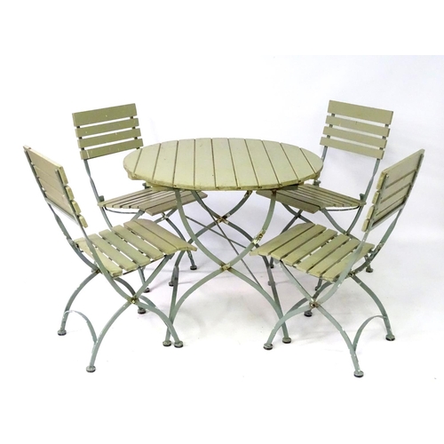 538 - Garden and Architectural Salvage: a French folding Bistro garden/patio set comprising of a circular ... 