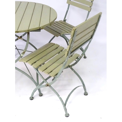 538 - Garden and Architectural Salvage: a French folding Bistro garden/patio set comprising of a circular ... 