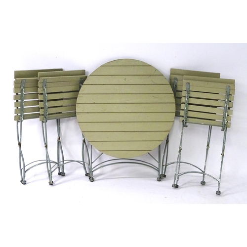 538 - Garden and Architectural Salvage: a French folding Bistro garden/patio set comprising of a circular ... 