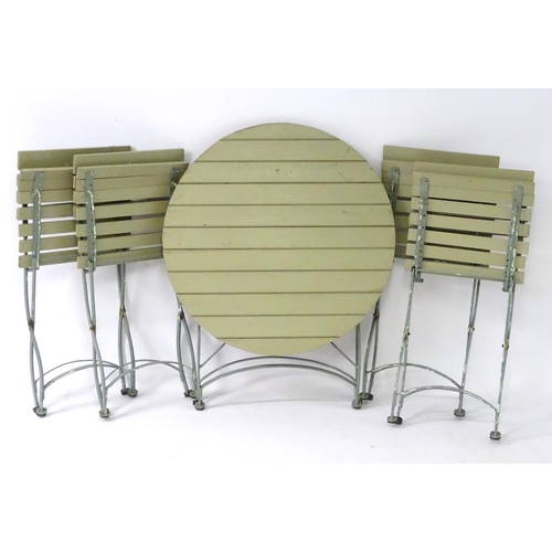 538 - Garden and Architectural Salvage: a French folding Bistro garden/patio set comprising of a circular ... 