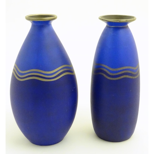 58 - Two blue studio pottery two-tone vases decorated with three gilt undulating bands, gilt rims and a b... 