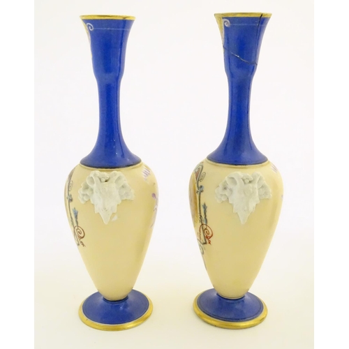 59 - A pair of vases with hand painted Roman portraits in roundels surrounded by scrolling decoration, an... 