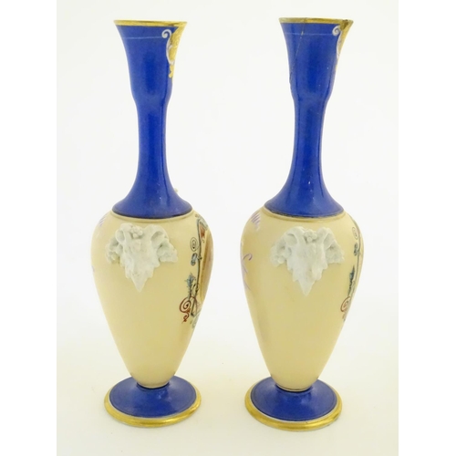 59 - A pair of vases with hand painted Roman portraits in roundels surrounded by scrolling decoration, an... 