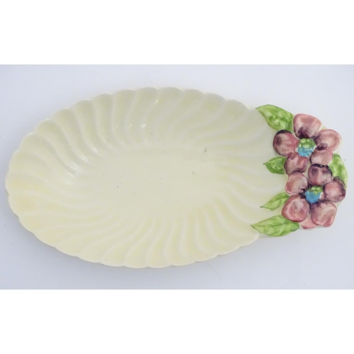 67 - A Royal Staffordshire scalloped oval shaped dish designed by Clarice Cliff, decorated with hand pain... 