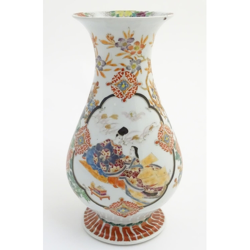 7 - A Japanese baluster vase with a flared foot and rim, decorated with two panel scenes depicting a you... 