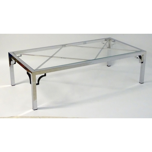 733 - Vintage Retro mid Century modern: A large chromed and glass topped coffee table with cross bracing, ... 