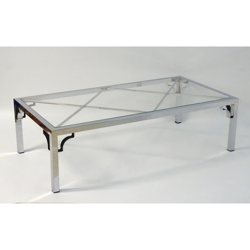 733 - Vintage Retro mid Century modern: A large chromed and glass topped coffee table with cross bracing, ... 