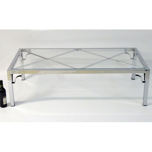 733 - Vintage Retro mid Century modern: A large chromed and glass topped coffee table with cross bracing, ... 