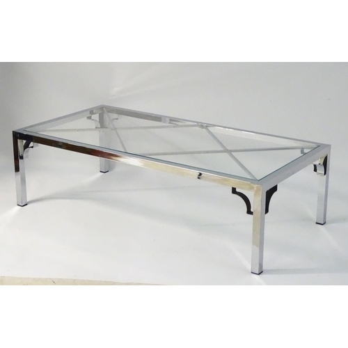 733 - Vintage Retro mid Century modern: A large chromed and glass topped coffee table with cross bracing, ... 