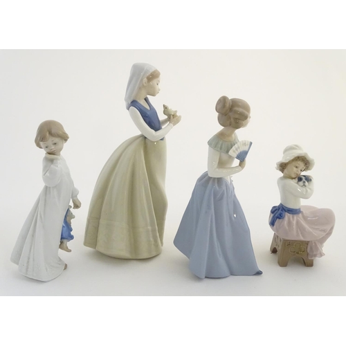 74 - Four Nao (by Lladro) figures, comprising 'My Rag Doll' no. 1108, a young girl holding her rag doll, ... 