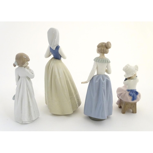 74 - Four Nao (by Lladro) figures, comprising 'My Rag Doll' no. 1108, a young girl holding her rag doll, ... 