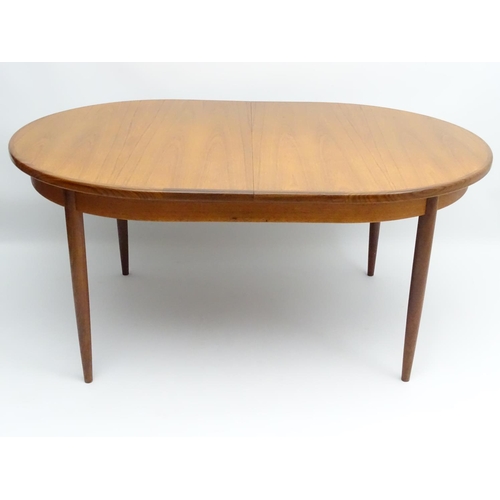 745 - Vintage Retro : a British G-Plan ( red ) teak extending table designed by Victor Bramwell Wilkins no... 