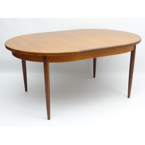 745 - Vintage Retro : a British G-Plan ( red ) teak extending table designed by Victor Bramwell Wilkins no... 