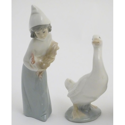 76 - A quantity of Lladro and Nao figures, to include two Lladro penguins and girl holding a chicken, a N... 